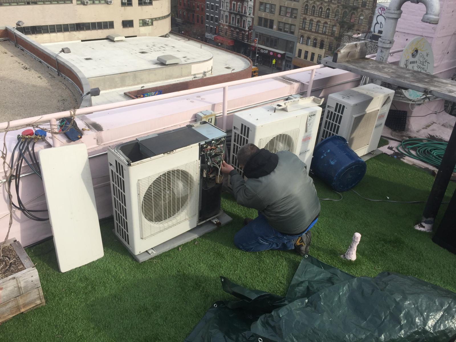 Ductless mini-split indoor unit and an air handler installed in a New York building